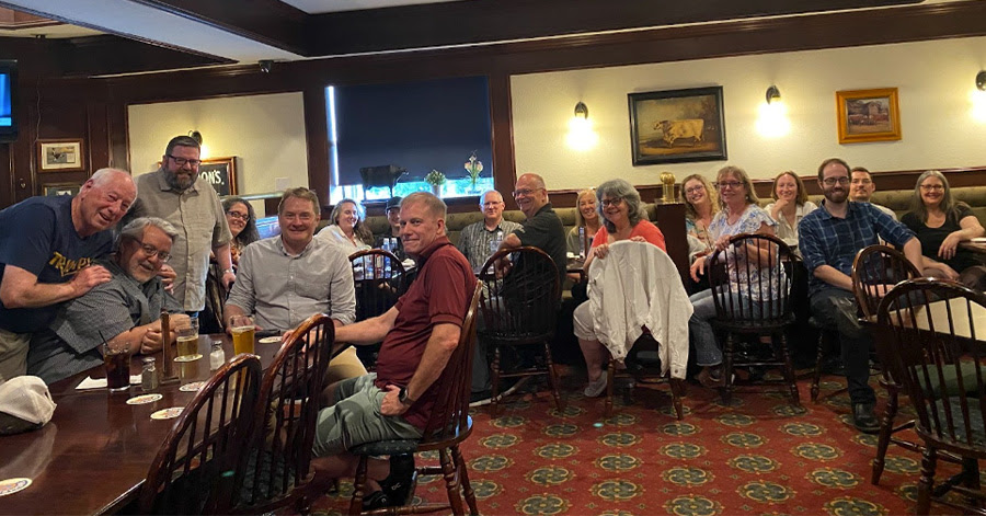 Group of editors gathering at a restaurant to spend time with each other at an editorial offsite event