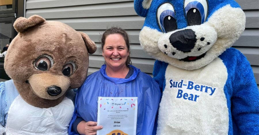 Jenny Lamothe posoing with the Sud-Berry bear