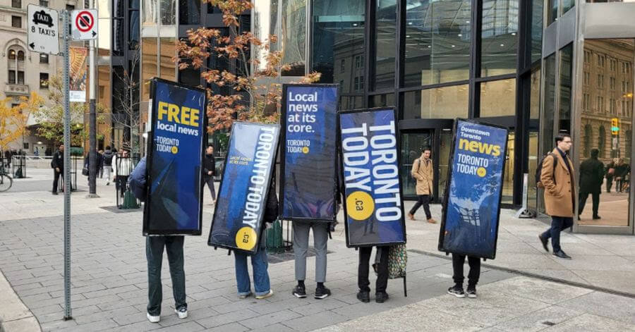 Walking billboards for TorontoToday.ca gathered in downtown Toronto