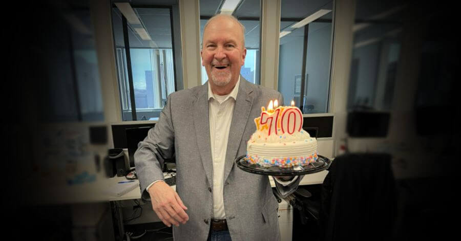 Sudbury.com health and mining reporter Len Gillis celebrating his 70th birthday with cake and spirits